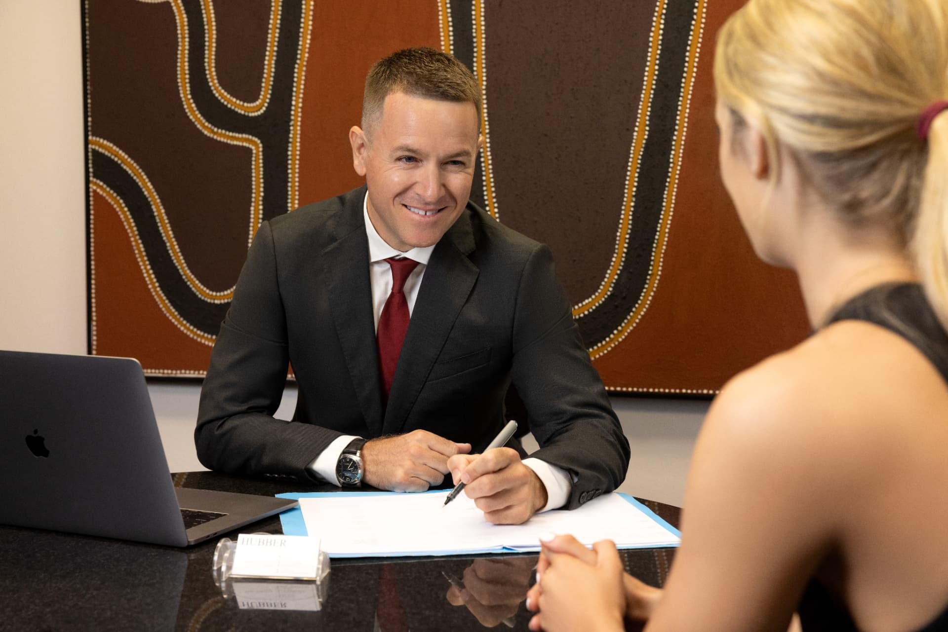 Matt Hubber meeting with a client at Hubber Legal's Darwin office